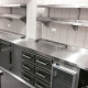 A stainless steel bench and shelving installed in a commercial kitchen
