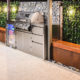 A custom outdoor entertaining area with a stainless steel barbecue